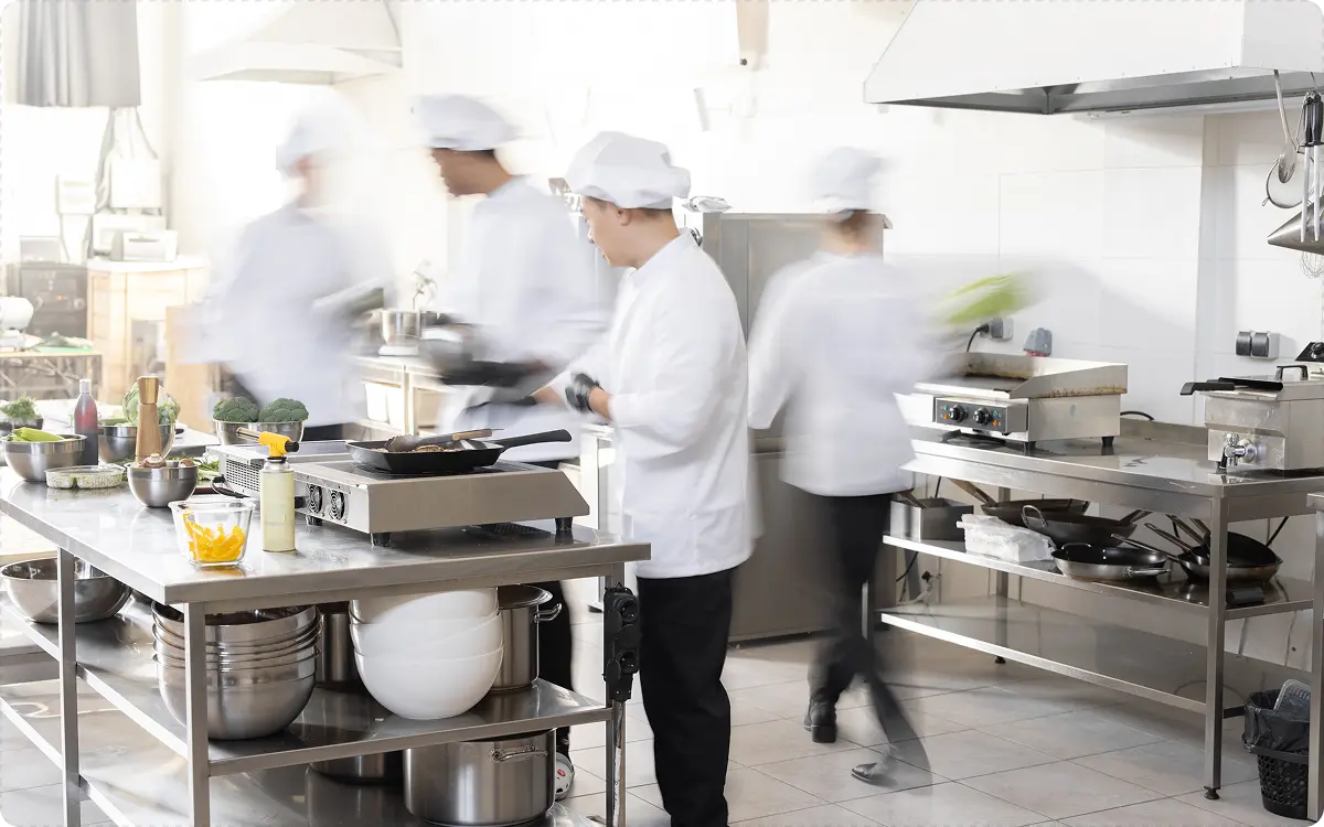 Chefs working in a busy commercial kitchen